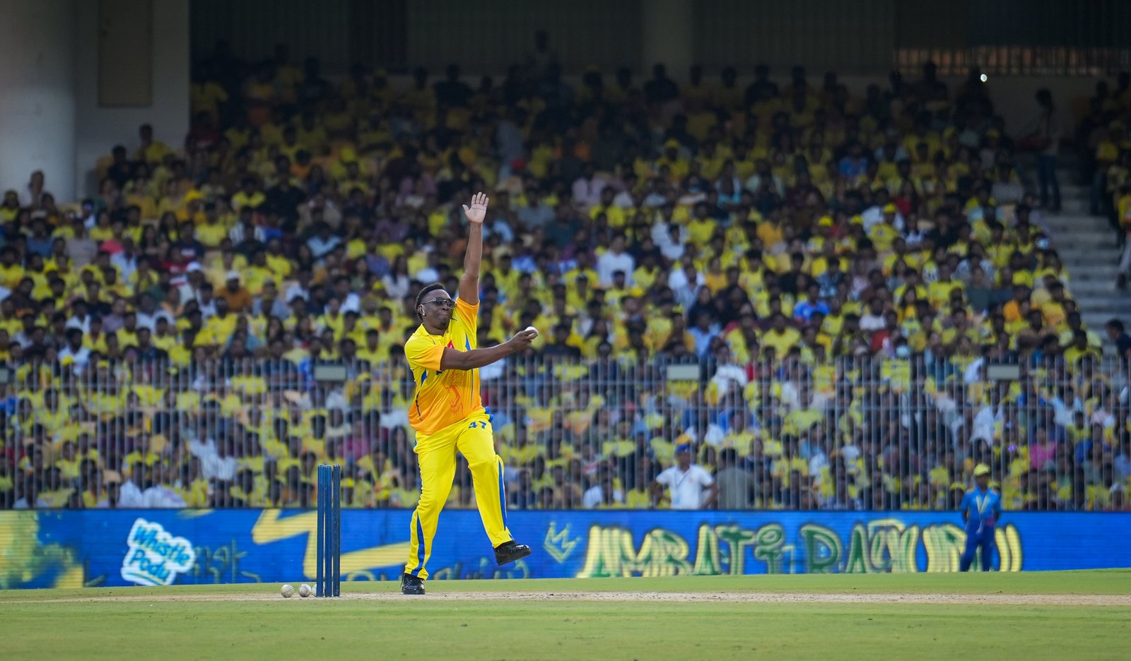 Fast bowler mid-delivery, IPL colours